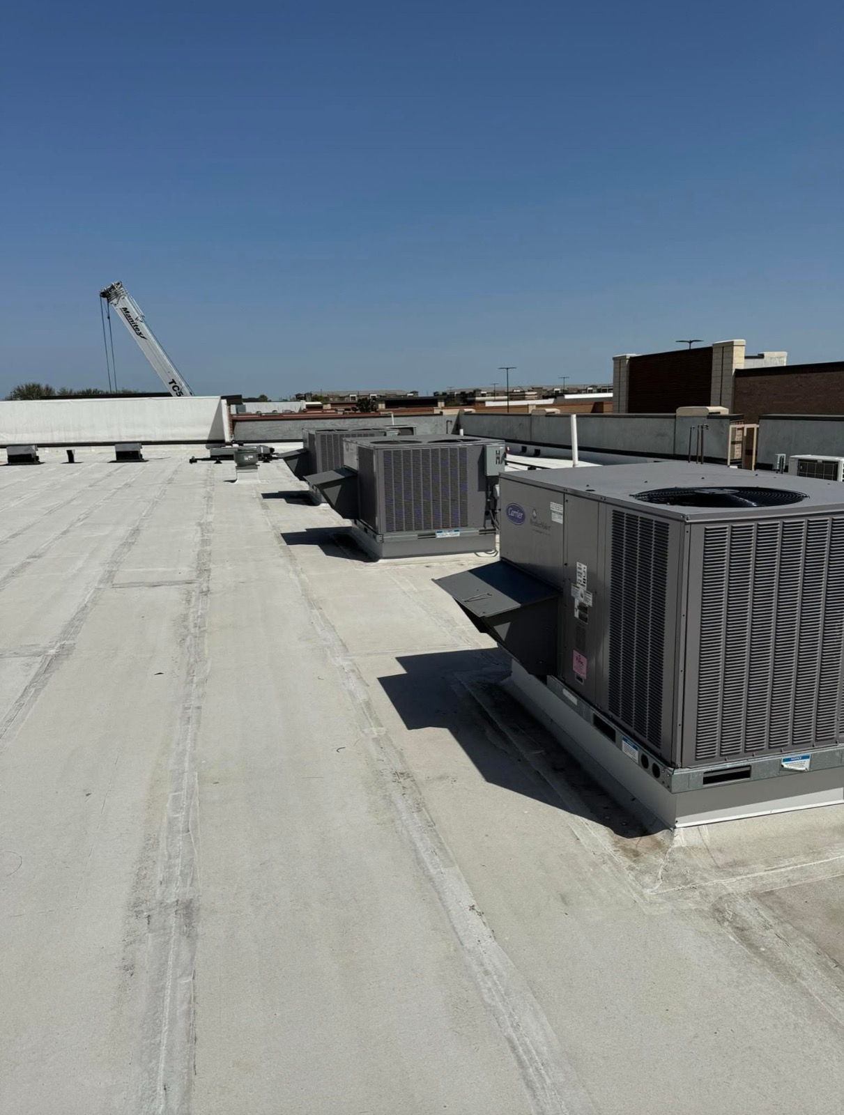 Commercial air handlers and sheet metal ductwork installed during a build-out